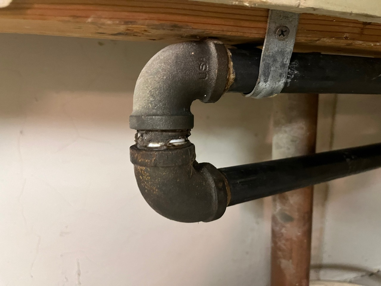 All-Plumb-Rooter Plumber assessing plumbing vents.